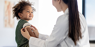 a young boy receiving a vaccination